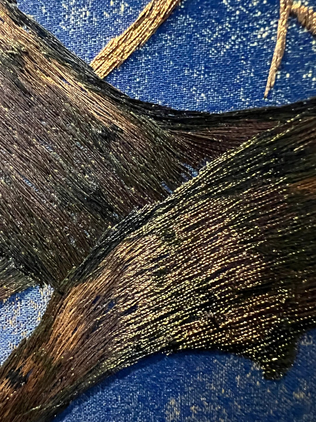 Close-up of raised embroidered tree bark texture